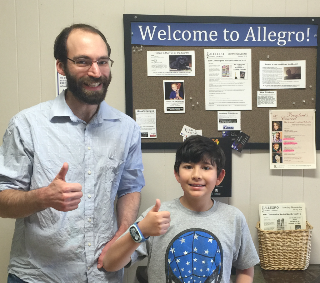 Nic G. (pictured with piano teacher, David DeSoucey) is student number 600 and he just won SIX MONTHS OF FREE LESSONS!